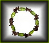 BRACELET PERIDOT FACETTE+QUARTZ FUME(16gr/élastique)